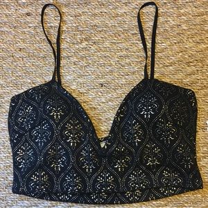 Black bralette/crop top with gold detailing.